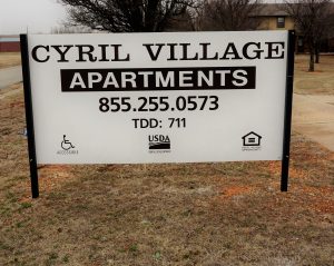 Cyril Village Apartments Sign