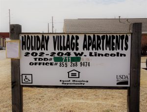 Holiday Village Apartments Sign