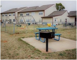 Anadarko Village Apartments - Grill, Picnic Table, & Playground